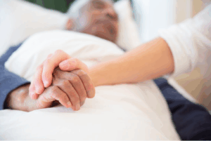holding hand man elderly care hospice frisco-tx